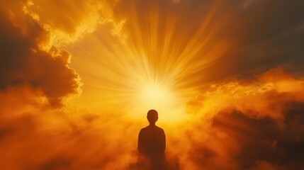 Obraz premium silhouetted figure in prayer against dramatic sunset sky, rays of golden light breaking through clouds, peaceful contemplative composition with spiritual overtones
