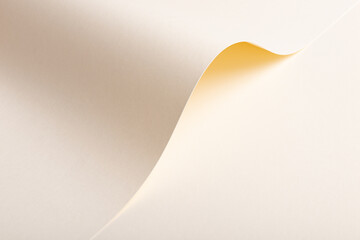 A gracefully curved beige paper background with a smooth, flowing texture. The soft, neutral tones...
