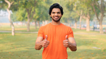 Indian Man Showing Thumbs Up with Both Hands