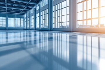 Fototapeta premium Large industrial hall with glass walls and sunlight streaming through, creating a futuristic workspace atmosphere. Concept of modern architecture and innovation.