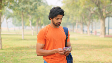 Indian College Student Counting Money, Indian Rupees