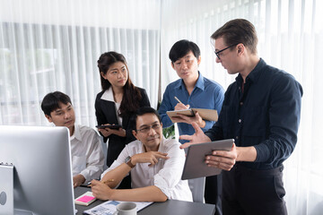Group of diverse office worker employee working together on strategic business marketing planning in corporate office room. Positive teamwork in business workplace concept. Prudent