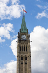 Parliament building with Canadian flag in Ottawa, Canada.