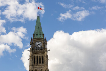 Parliament building with Canadian flag in Ottawa, Canada.