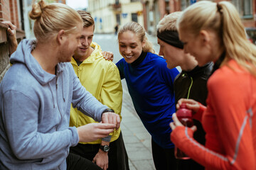 Young people stretching and getting ready to go jogging in the city