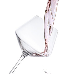 Pouring rose wine into glass isolated on white