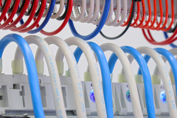 Connection of electrical modules using insulated copper electrical wires. Close-up. Soft focus.