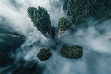 aerial orthographic view of towering sandstone pillars of zhangjiajie rising dramatically through sea of swirling mist