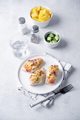 Cream cheese bacon chicken breasts in a plate