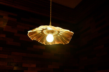 Vintage light bulbs hanging from the ceiling in restaurant ,creating a warm and inviting atmosphere,Scene is warm and inviting,Luxury beautiful retro edison light lamp decor,space for text..