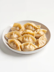 Homemade dumplings served on a white plate ready for a delicious meal with family or friends during a cozy gathering