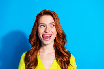 Photo of pretty girl with ginger hairstyle dressed yellow cardigan look at offer empty space lick...