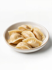 Delicious homemade dumplings served in a bowl, perfect for a cozy meal during any season