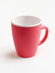 Bright red ceramic mug with white interior perfect for coffee or tea during a cozy morning at home
