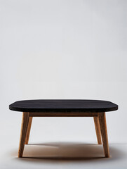 Modern wooden coffee table with unique shape and minimalist design in neutral tones