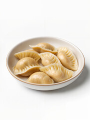Dumplings filled with savory ingredients served in a bowl on a clean table