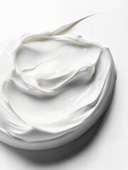 Creamy white substance swirled on a smooth surface prepared for skincare application