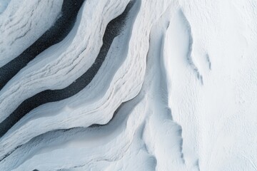 Obraz premium aerial orthographic view of snow-covered dolomite peak its pristine white surface marked by winding ski trails