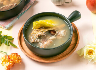 Ginseng Glutinous Rice Chicken Soup served in bowl on wooden tray side view of taiwan hot soup