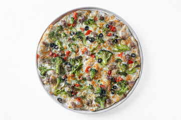 a traditional Italian pizza with sausage, broccoli, mozzarella and hot sauce, cherry tomatoes, isolated on white background