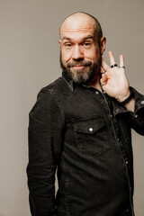 Vertical headshot of smiling wondering mature man looking away posing indoor. Mindset concept.