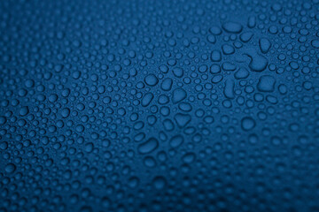 water drops on the blue metal surface, abstract background, and macro window after the rain, blue...