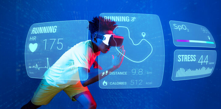 African man jogging or using augmented reality goggle and artificial intelligence practicing and training. Male model with shirt doing running posture and looking at hologram. Technology. Ingenuity.