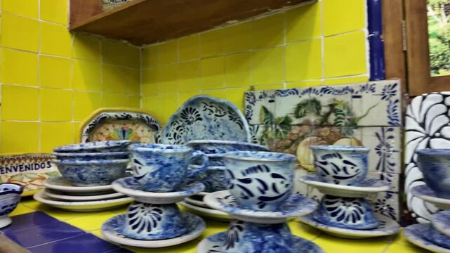 A collection of colorful plates and bowls on a counter