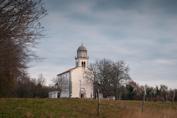 Church of holy mary of obersljan on Karst region of slovenia, close to Komen. Late autumn setting...