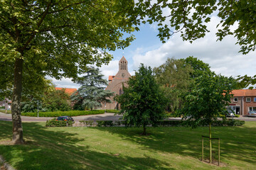 Exploring the charming green space of Noordhoek with the historical church in view on a sunny day