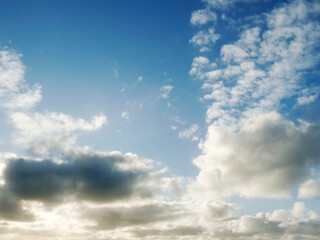 Warm cloudy blue sky. Nature background for design or sky replacement.