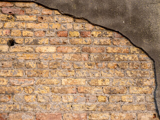 A brick wall with a brown and red color. The wall is made of bricks and has a rough texture, Background for design