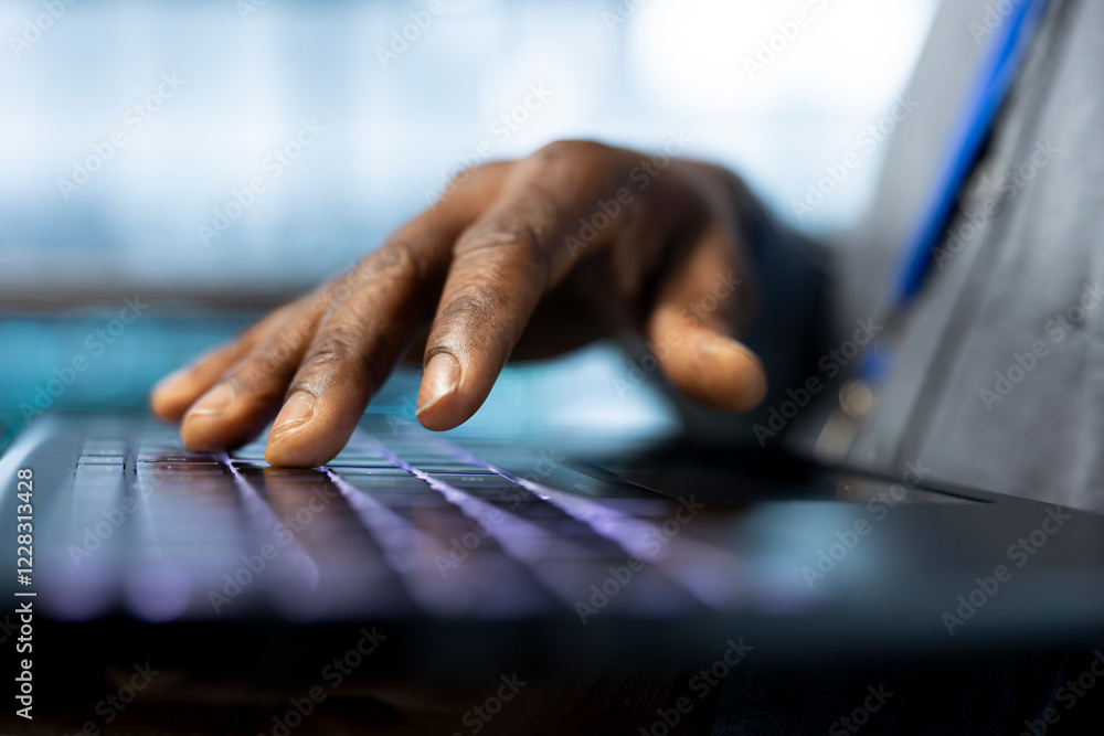 Poster engineer in data center typing on laptop keyboard, automating routine maintenance tasks, executing d