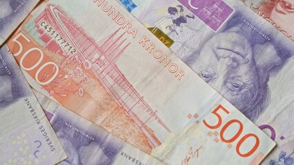 Swedish banknotes in various denominations, including 500 kronor, displaying iconic national imagery.
