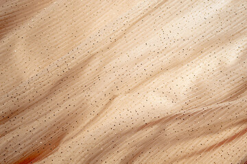 Concept with waves shampagne mesh fabric. Retro fashion aesthetic. Can use as wedding background. Luxurious background design
