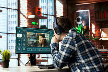 Man in home office listening music and using generative artificial intelligence GPT generating...