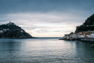 Tranquil Coastal View of San Sebastián with Monte Urgull and Historic Buildings