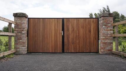 View of a large wooden gateway at the entrance of a country estate drive in rural England