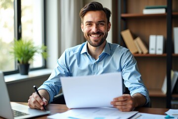 Obraz premium Professional Young Man Smiling While Holding Documents in a Bright Office Space Surrounded by Books and Greenery
