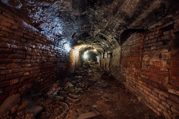 Dark dirty red brick abandoned tunnel