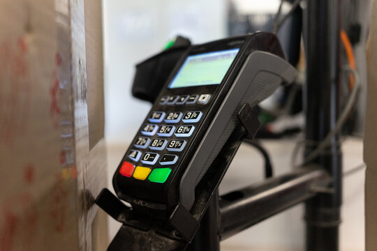Payment terminal ready for transactions at busy retail checkout area