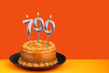 Candle number 700 - Number of followers or likes.