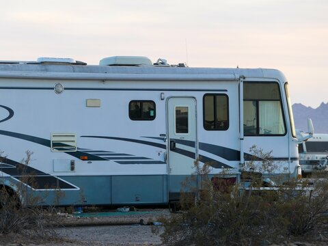 Old A-Class RV stealth camping in the desert