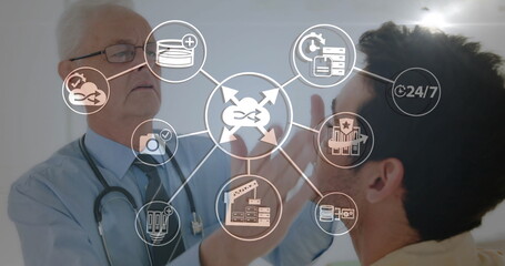 Image of network of connections with icons over caucasian male doctor examining patient