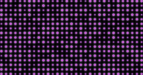 Image of pulsating purple spots of light on black background