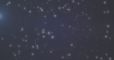 Naklejka premium Twinkling stars image over dark blue night sky background