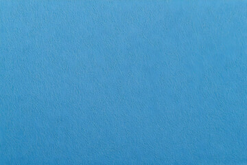 Obraz premium Close-up of textured light blue surface shows fine details and variations, creating a background.