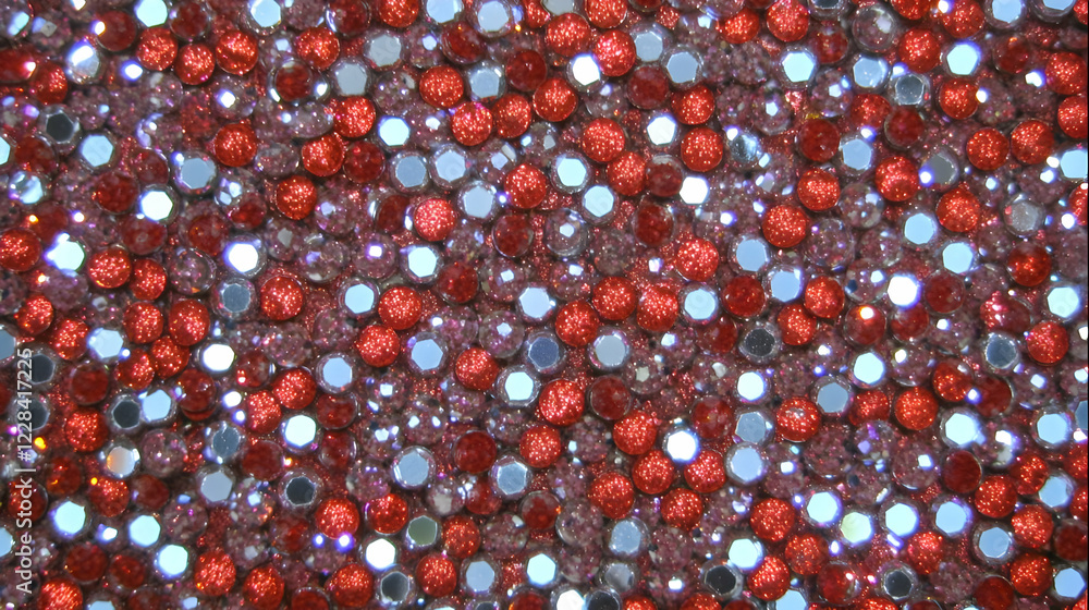 Poster red and silver sequins shimmer close up and create a sparkling festive texture background