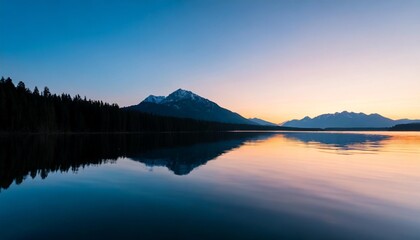 Fototapeta premium A stunning sunset over a calm lake with silhouettes of trees and mountains reflecting on the water.