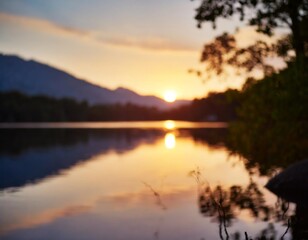 Fototapeta premium A stunning sunset over a calm lake with silhouettes of trees and mountains reflecting on the water.